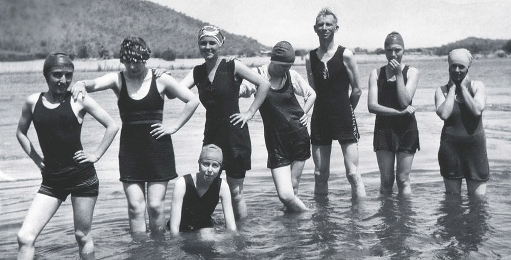 Black and white image of the Zetetic Society in their swimsuits standing in the Salt River c. 1923.